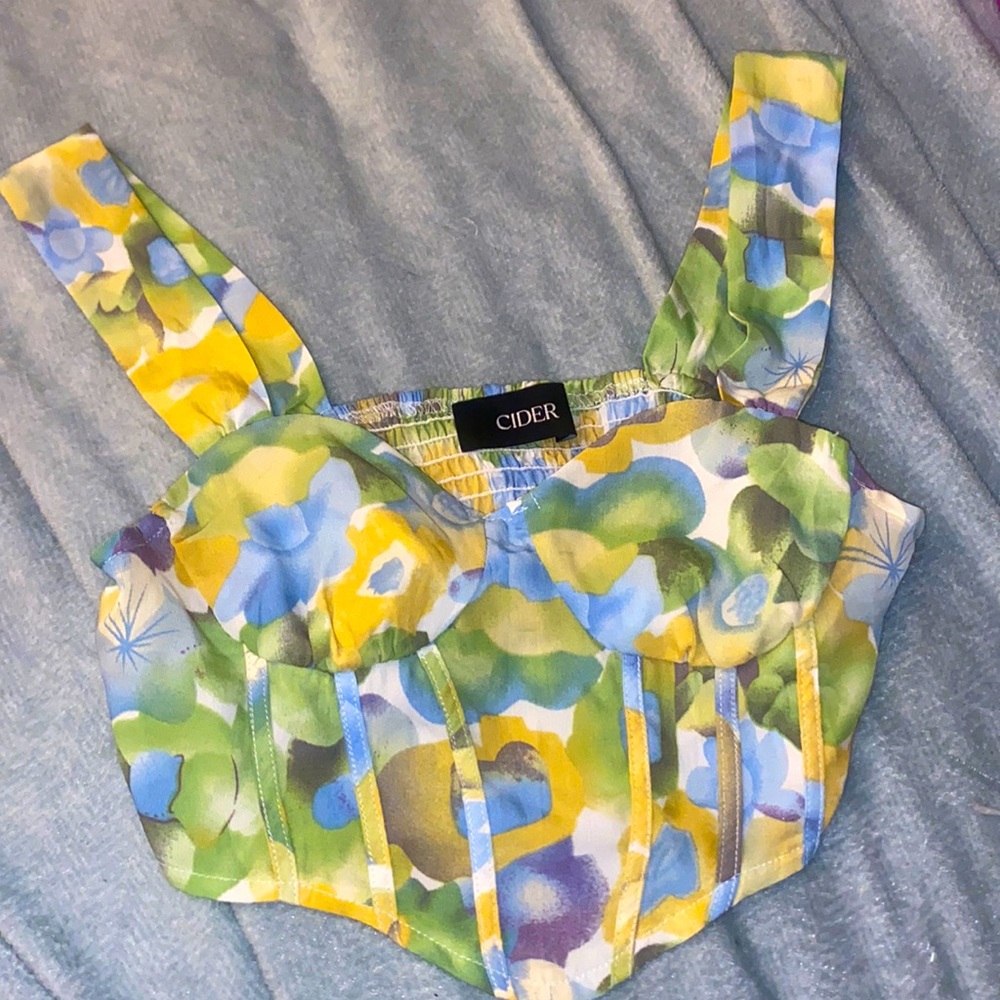 This is a floral corset top from shop cider. It is a size small.